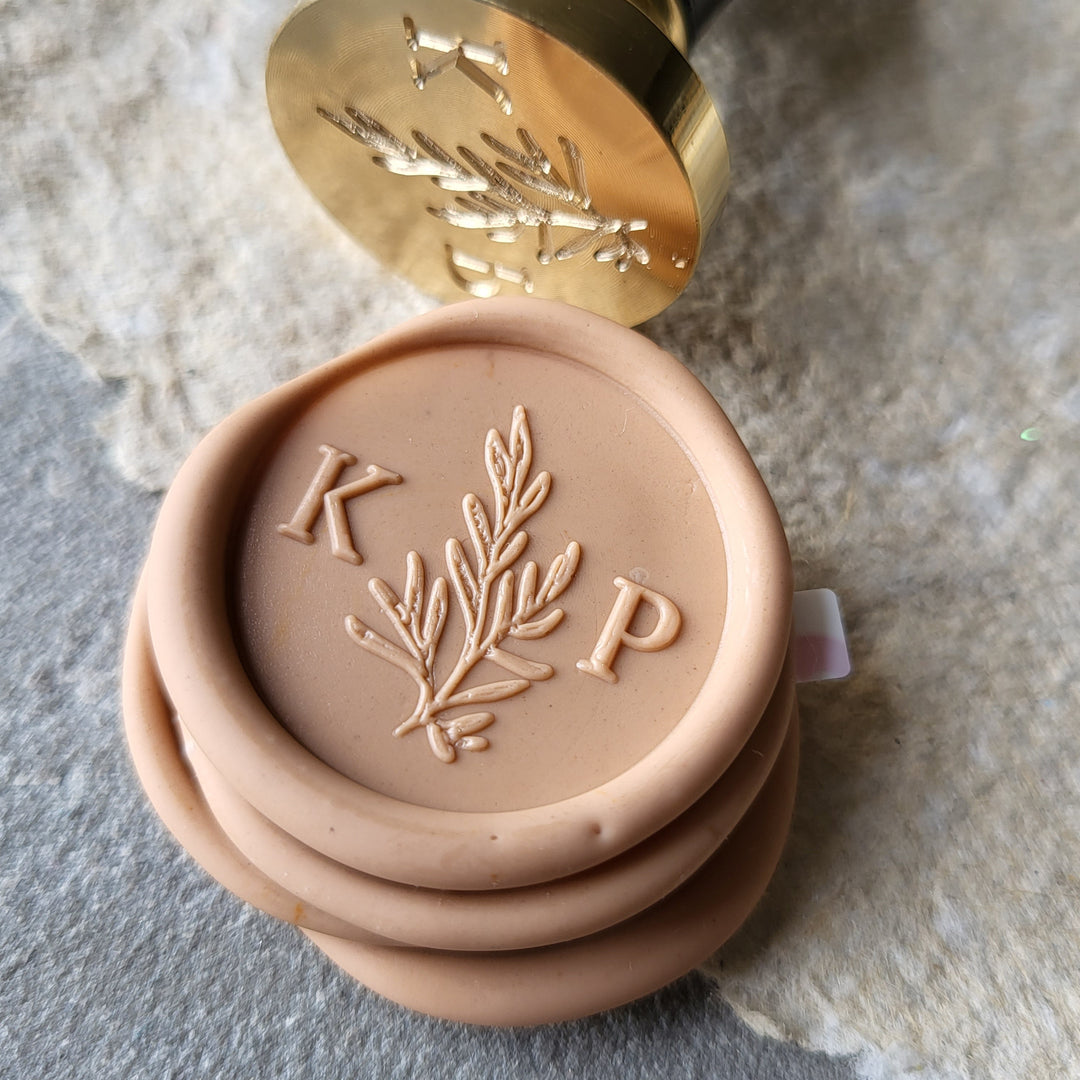 Peach 'Willow' monogram wax seals with initials 'K' and 'P,' featuring a botanical design and peel-and-stick adhesive backing.