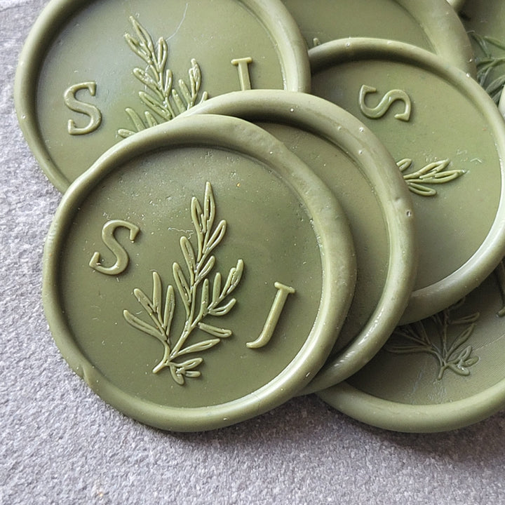 Green 'Willow' monogram wax seals with custom initials 'S' and 'J,' featuring a peel-and-stick 3M adhesive backing.