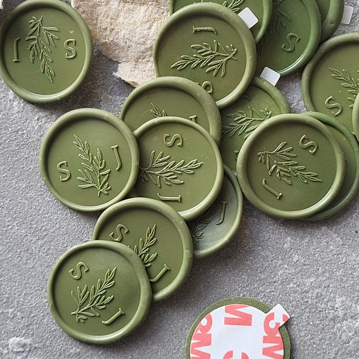 Collection of green 'Willow' monogram wax seals with initials 'S' and 'J,' made with traditional hand-mixed wax and 3M adhesive.