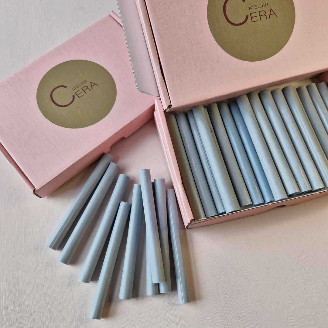 Open box of French Blue 11mm sealing wax sticks with some sticks displayed outside. Ideal for wax seals and creative projects.