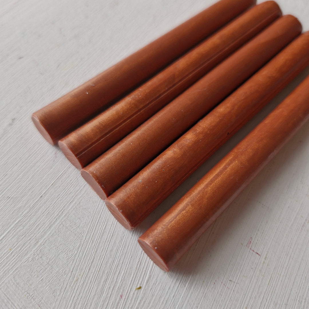 Set of five 11mm copper rods from a box of 50, ideal for office instruments and crafting applications.