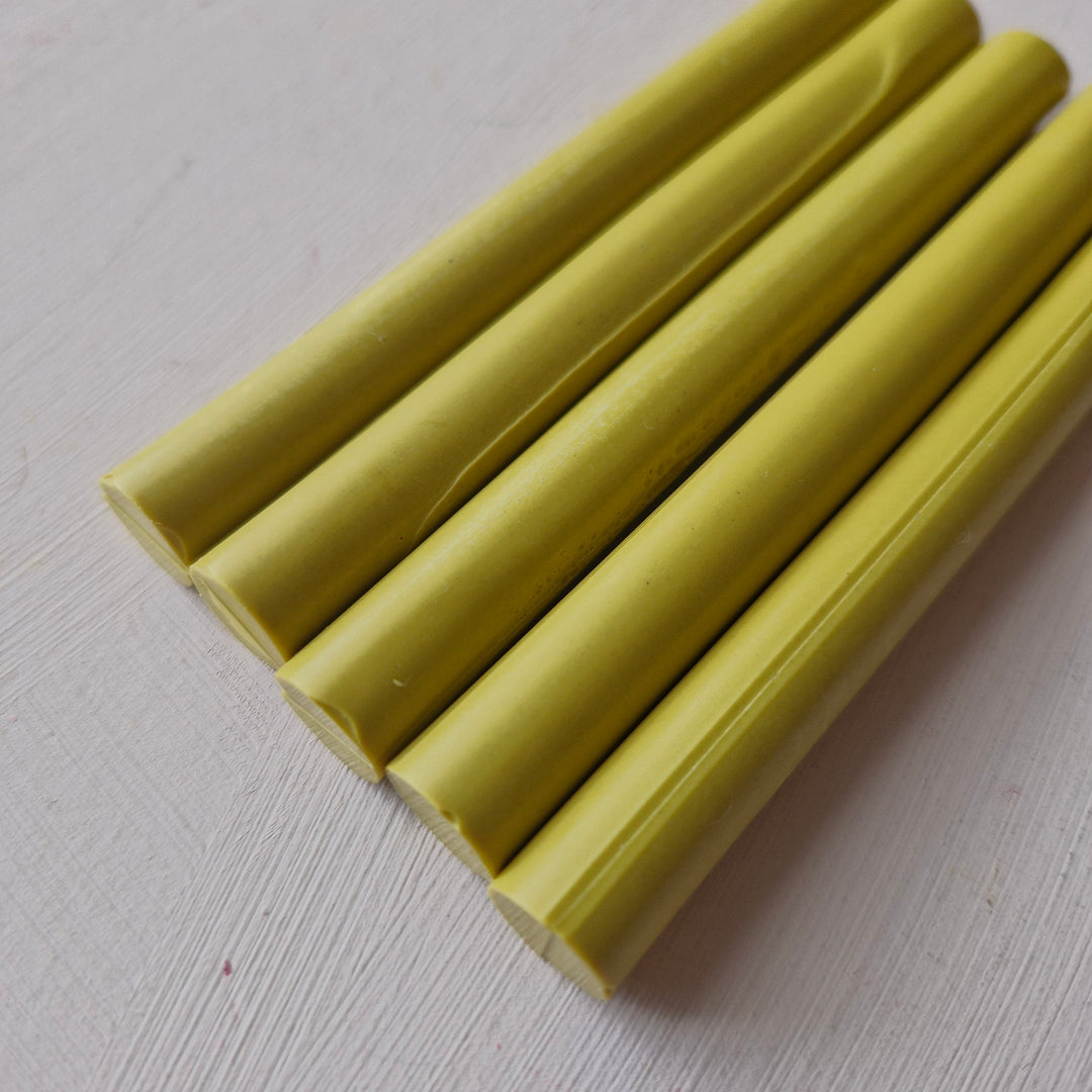 Box of 50 - 11mm Lagoon glue sticks in a vibrant yellow shade, ideal for office and crafting use. High-quality adhesive for versatile applications.