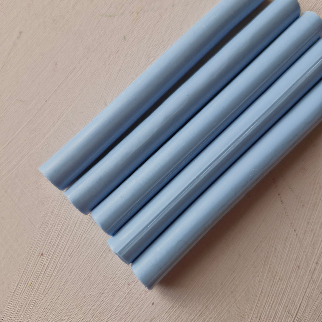 Close-up of 11mm dusty blue office instrument sticks from a box of 50, ideal for crafting or office use.