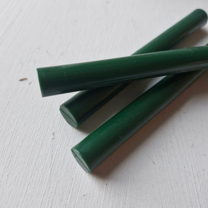 Close-up of British Racing Green sealing wax sticks, 11mm thick, ideal for creative projects and sealing envelopes. Sold in a 10 pack.