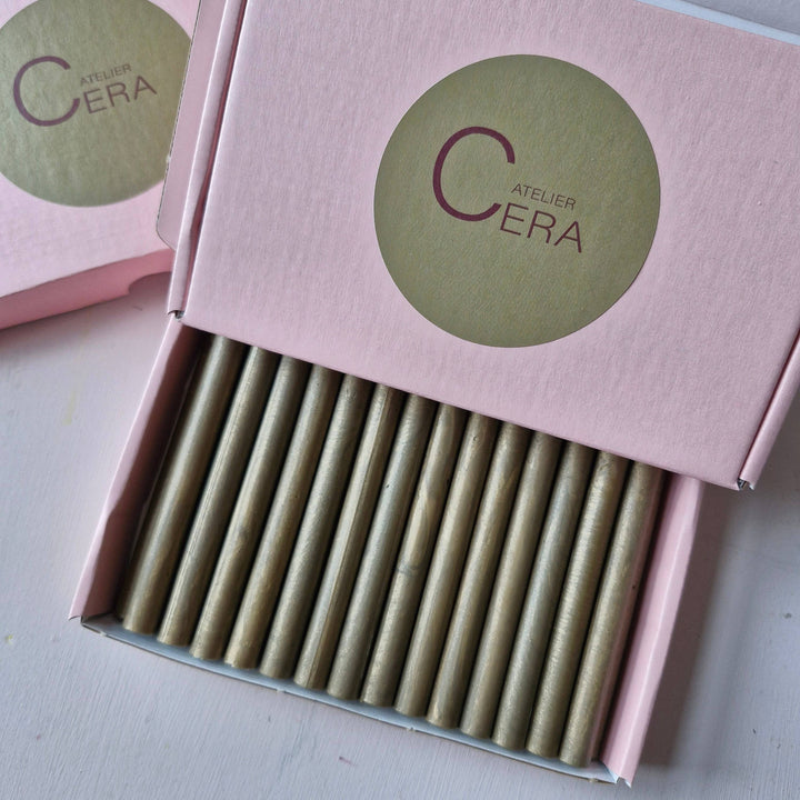 Box of 30 11mm French Gold Wax Sticks in pink packaging with Atelier Cera branding. Ideal for sealing and crafting needs.