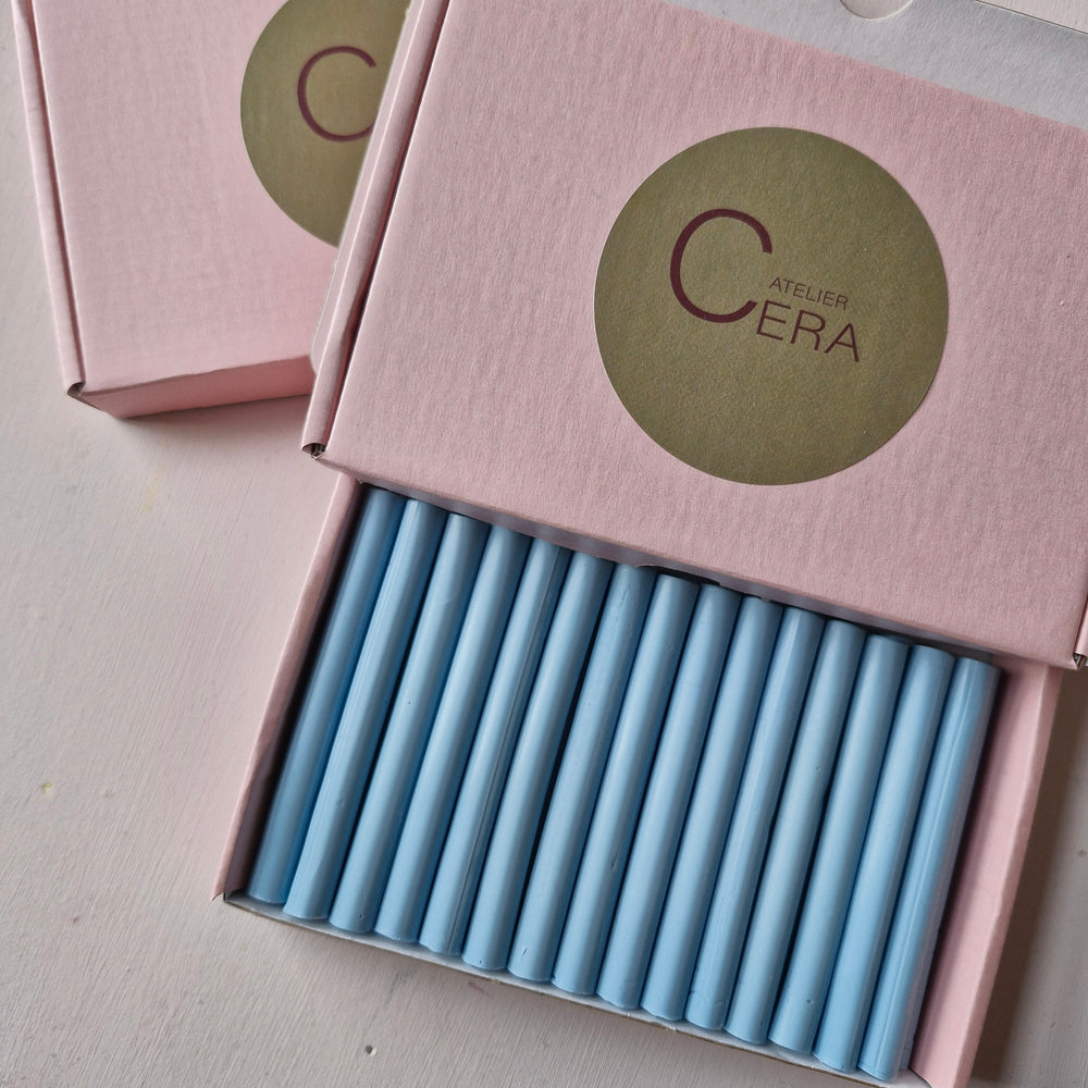 Open box of 30 dusty blue 11mm sealing wax sticks neatly arranged, perfect for handmade sealing projects.