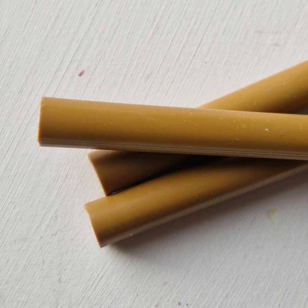 Hand-mixed 11mm toffee wax sticks, perfect for creating durable and elegant seals with glue gun compatibility.