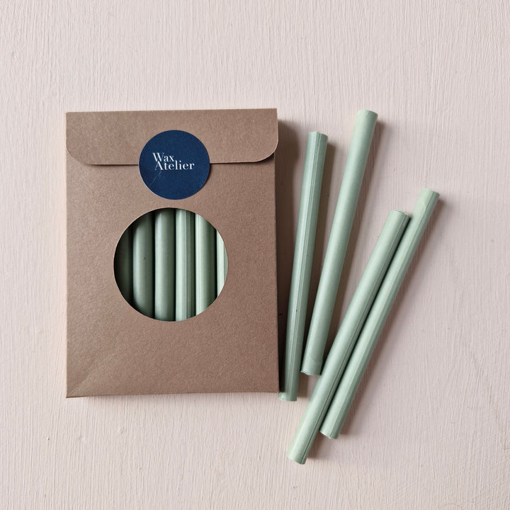 7mm Sage Sealing Wax Sticks in a pack of 10. Handmade wax sticks in a soft green hue, ideal for sealing envelopes, invitations, and crafts.