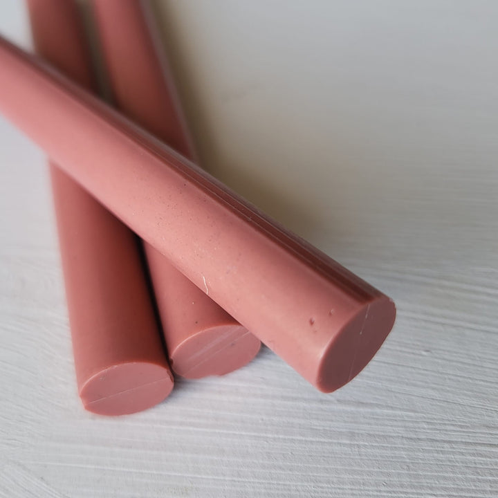 Close-up of 10 pack of 11mm antique pink sealing wax sticks, ideal for crafting and office use in elegant correspondence.