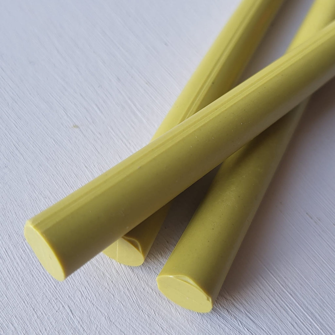 Close-up of 11mm lagoon-colored sealing wax sticks from a 10-pack, ideal for crafting and office use in sealing documents.