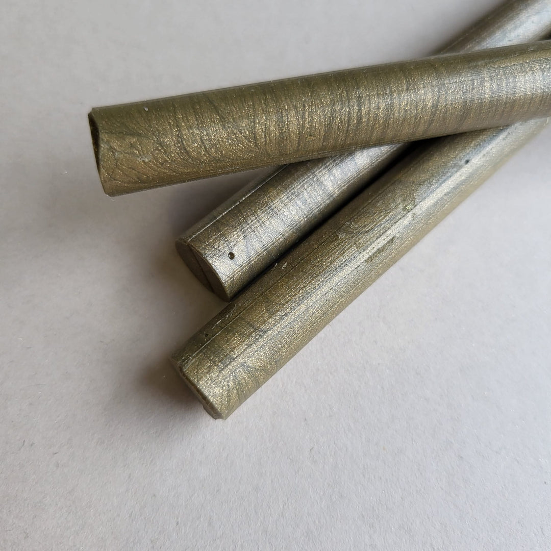 Detailed view of French Gold sealing wax sticks in 11mm size, showcasing their smooth metallic texture. Perfect for creative projects and sealing.