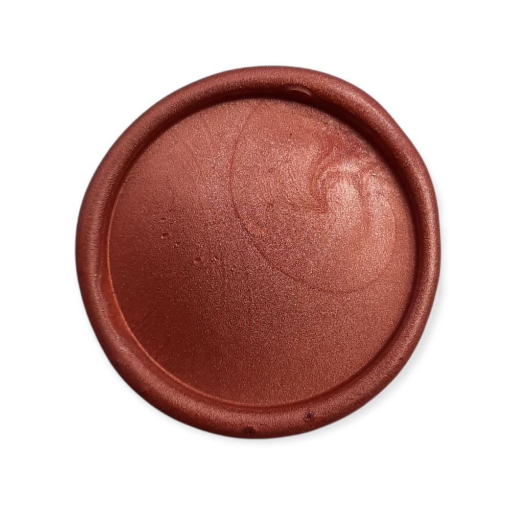 Close-up of a burnt orange wax seal with a smooth, glossy finish, showcasing the quality of the sealing wax sticks.