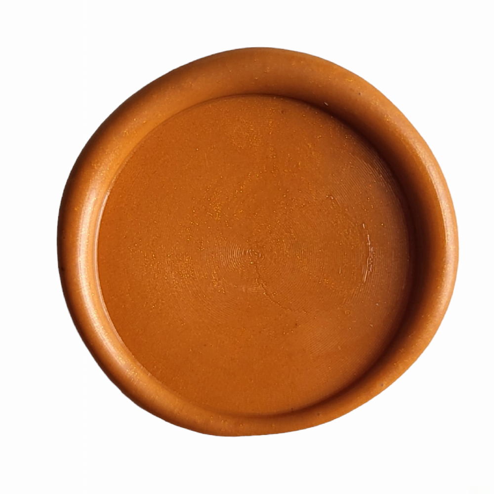 Close-up of a circular sienna-colored wax seal, showcasing its smooth texture and vibrant finish.