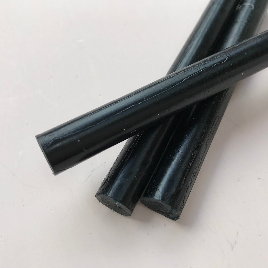 Close-up of three black 11mm sealing wax sticks from a 10-pack, ideal for office use and crafting in the Office Supplies category.