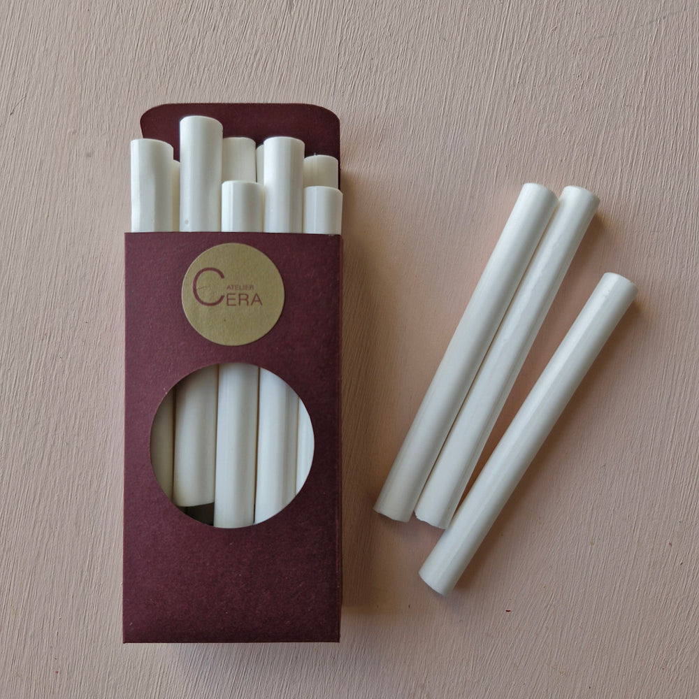 10 pack of Chelsea white sealing wax sticks, 11mm diameter, displayed in a burgundy box with some sticks placed outside. Ideal for glue gun use.