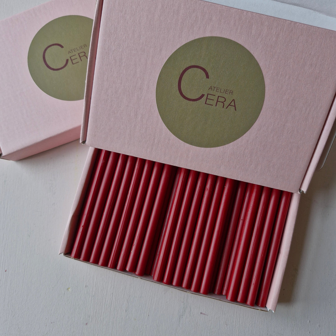 Open box displaying 60 handmade classic red 7mm sealing wax sticks, suitable for glue gun applications and creative projects.