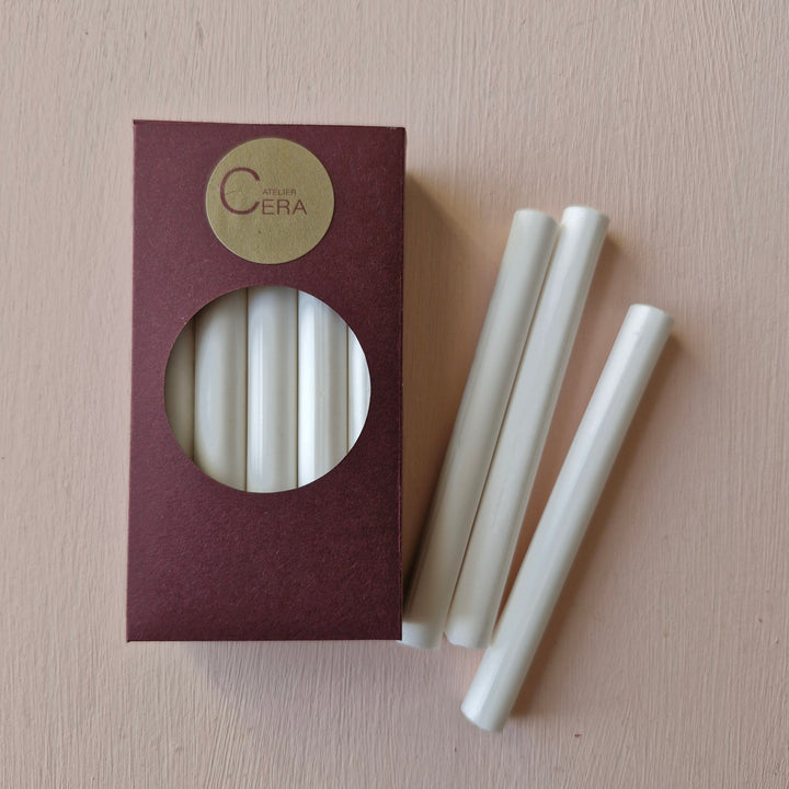 10 pack of Chelsea white 11mm sealing wax sticks in a burgundy box with a circular window, ideal for glue gun use in office projects.