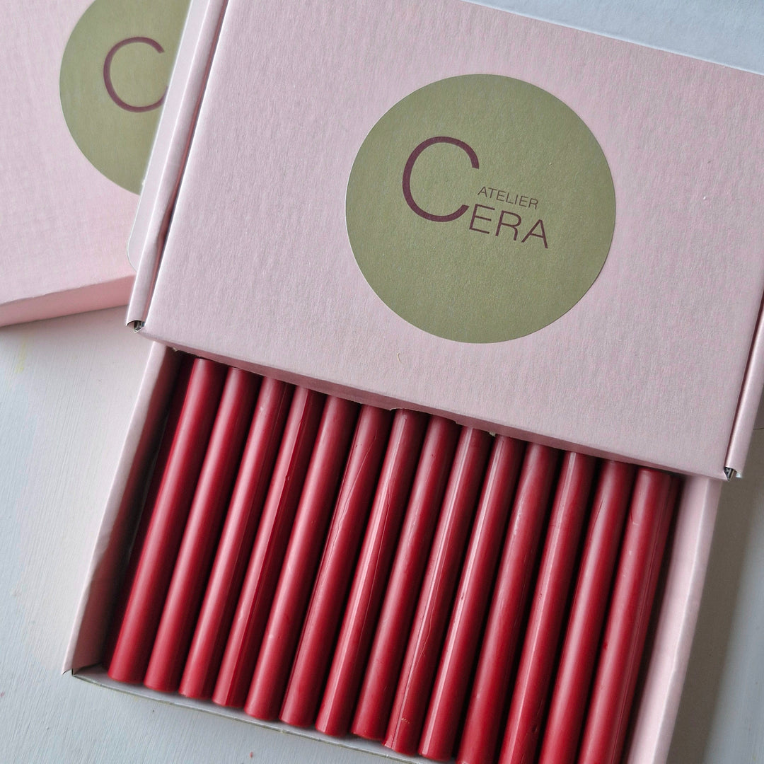 Box of classic red sealing wax sticks with 'Atelier Cera' branding on the lid. Contains 100 11mm sticks for sealing needs.