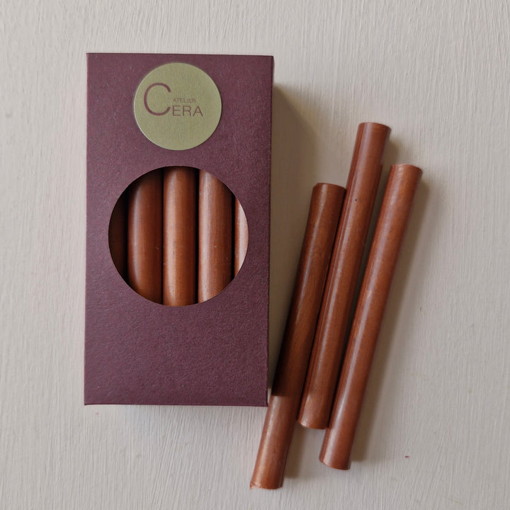 10 pack of copper sealing wax sticks in a burgundy box with a circular window, ideal for creating elegant seals on invitations or branding.