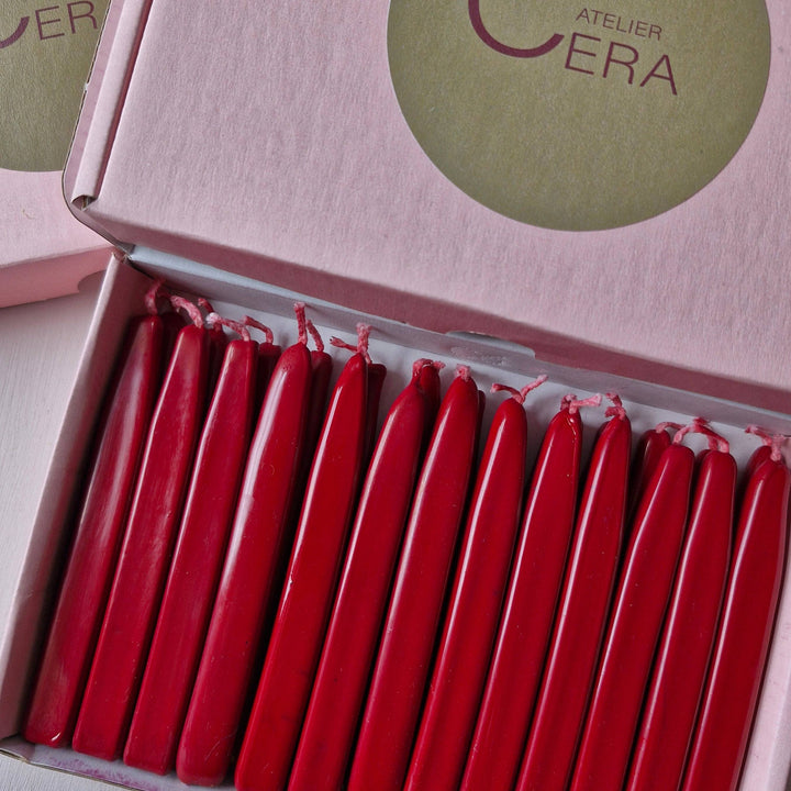 Detailed view of red sealing wick wax sticks in a pink Atelier Cera box, perfect for mailing or crafting projects.