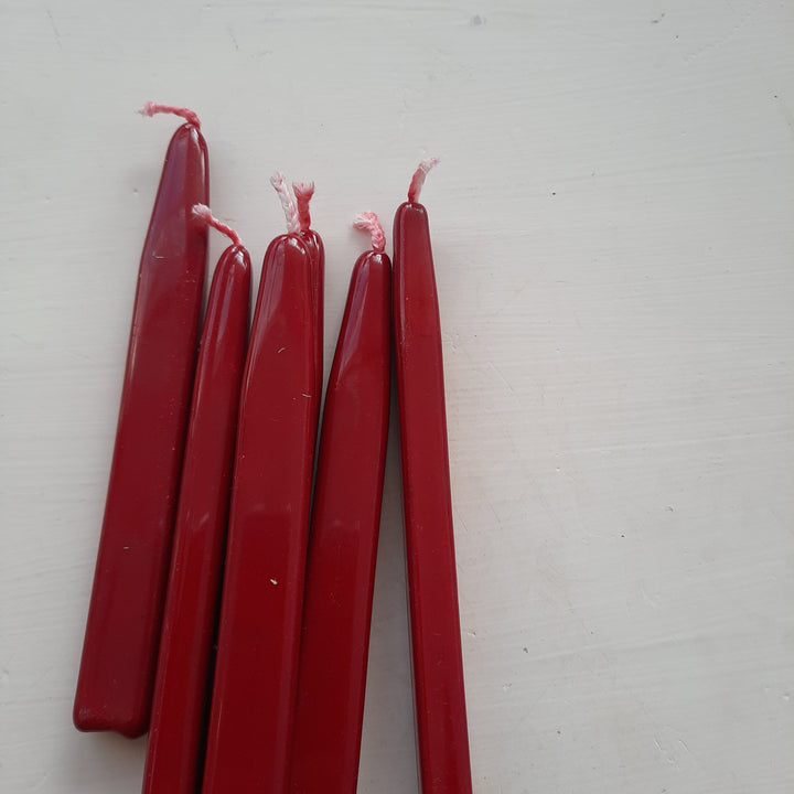 Five red sealing wick wax sticks with pink wicks arranged on a white surface. Designed for easy and traditional seal-making.