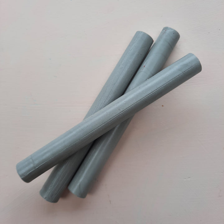 Close-up of 11mm mid grey sealing wax sticks, perfect for crafting 10 seals using a hotmelt glue gun for flexible and durable results.